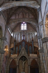 Fototapeta premium The inside of a church with a large organ