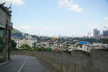 A city view with a road that is lined with buildings