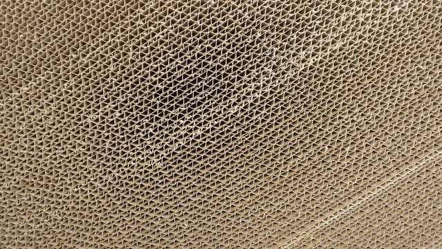 Folded corrugated cardboard sheets, view from the top. Paperboard cross section stacked in a row