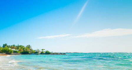 Blue sky and turquoise water in a tropical beach