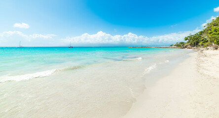 Turquoise water and white sand in a tropical beach