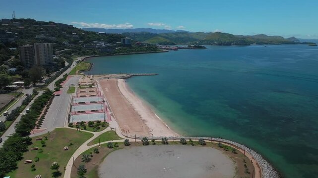 Ela Beach Port Moresby Papa Papua New Guinea Aerial drone boat PNG APEC Haus Convention center Capital City Central Business District wharf Harbor Idlers Bay Hilton Marriot Crowne Plaza forward down