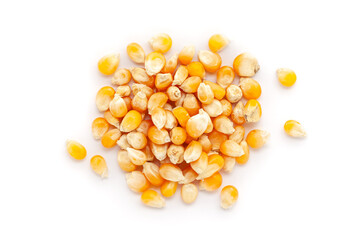 A close-up pile of organic Corn Seeds (Zea mays) or Makka, isolated on a white background. Top view
