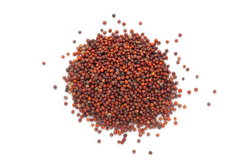 A close-up pile of organic Ragi (Eleusine coracana) or Finger Millet, isolated on a white background. Top view