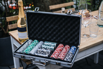 Poker Chips Set with Champagne on Table
