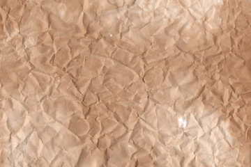 Old parchment vintage paper with a glowing and Brown crumpled wet craft texture grunge vignette copy space empty background.