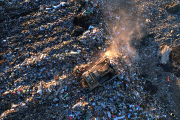 Landfill garbage truck. Garbage truck unloads rubbish in landfill. Landfill waste disposal. Garbage dump, waste plastic. Reduce greenhouse, methane emissions. Mustard gas among toxic waste in landfill