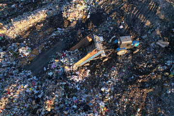 Landfill garbage truck. Garbage truck unloads rubbish in landfill. Landfill waste disposal. Garbage dump, waste plastic. Reduce greenhouse, methane emissions. Mustard gas among toxic waste in landfill