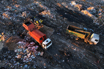 Landfill garbage truck. Garbage truck unloads rubbish in landfill. Landfill waste disposal. Garbage...