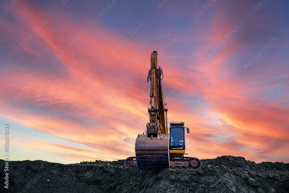 Canvas Prints excavator on sunset background. open-pit mining. backhoe dig ground in quarry. heavy construction eq