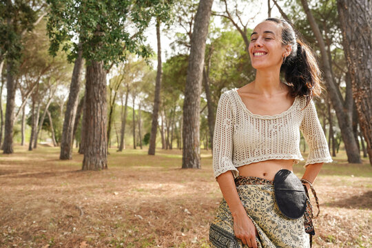 Happy woman with ostomy bag after colon cancer treatment. Medical theme