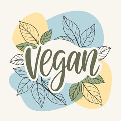 The word vegan is in leaves on a naturethemed colorful background