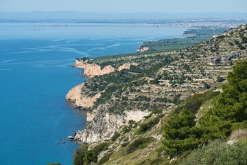 View of cliffs and Manfredonia city in the background. Gargano, Italy, Europe.