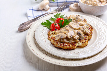 Cauliflower steak with mushrooms.