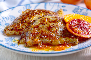Crepes suzette - pancakes with orange sauce.