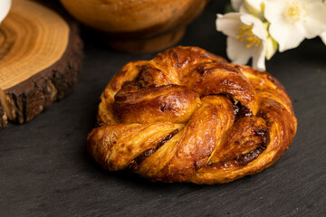 braided fresh bun for tea on the table