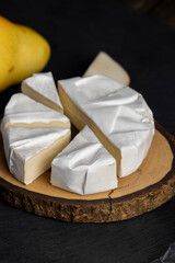 melted cheese with white mold on the table