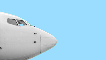 Airplane. Front section. Large commercial airliner cabin windows and bodywork sensors. Blue sky clouds background.