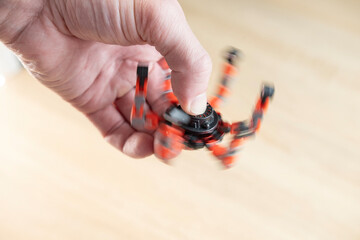 Spinner in male hand, stress relief, useful for people who are recovering from arm injury or suffer...