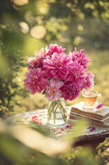 Photo of a bouquet of pink peonies in the garden.