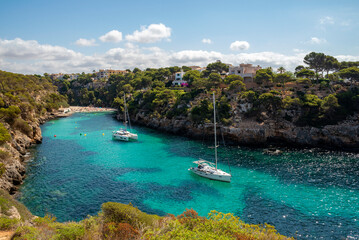 Fototapeta premium Cala Pi with turquoise waters and a picturesque environment, is one of the most beautiful coves in the island of Majorca, located in the municipality of Llucmajor, Balearic Islands, Spain