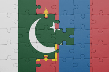 puzzle with the colourful national flag of mongolia and flag of pakistan .