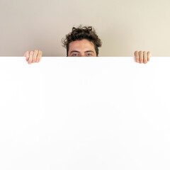 Hidden Face Behind Blank Sign - Ideal for Presentations and Promotions