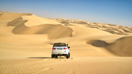 Jeep safari in the dunes near Walvis Bay in Namibia © vladimirzhoga