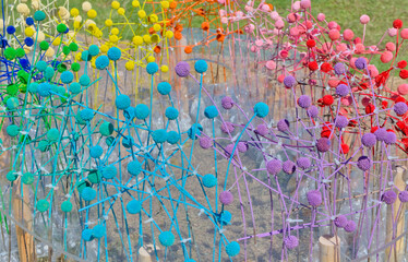 Colorful balls and sticks chaotically arranged to decorate an open space, impromptu art decor