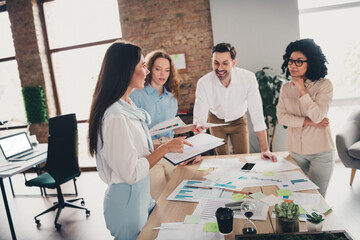 Photo of talking chatting teamwork young people working together employees modern industrial open...