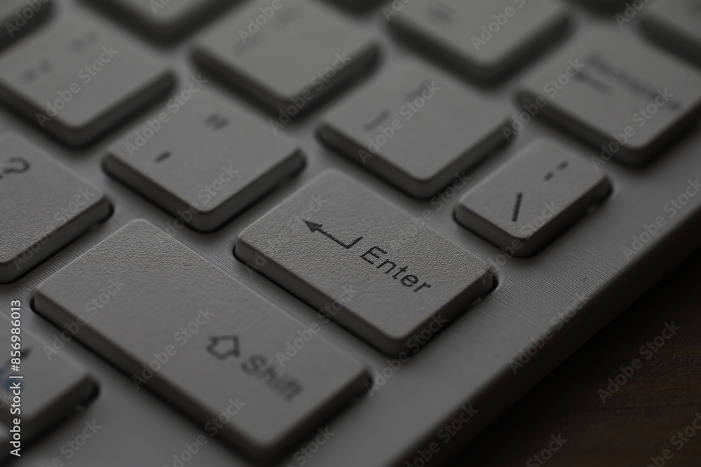 Aufkleber close-up of enter key on modern white keyboard - high-resolution detail for technology and computing