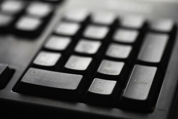 Close-Up of Black Computer Keyboard Keys Highlighting the Enter Button for Technology and Office...