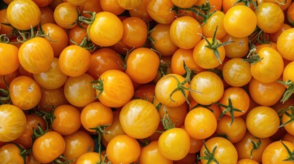 Heap of small yellow ripe juicy tomatoes