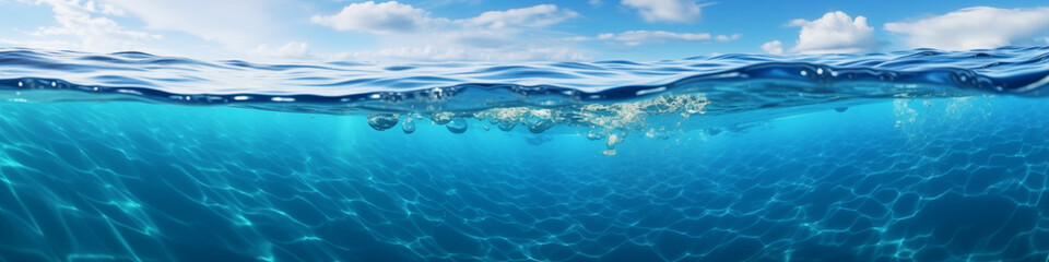 Fototapeta premium The ocean in section. The image shows a blue sky at the top and the sea cut along the bottom