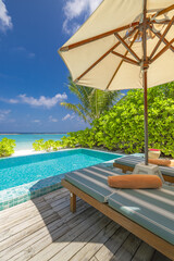 Fantastic private villa, terrace view with sun beds chairs under umbrella, luxury pool hotel stunning summer pattern. Beautiful spa or wellness, recreational vacation resort tourism. Tranquil sea sky