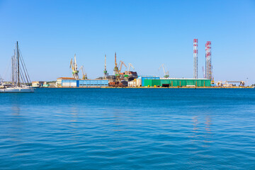 Fototapeta premium View of the port of Pula, Istria Croatia. Vibrant blue sky contrasting with the sea and port