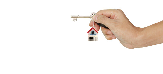 Real estate agent handing over house keys in a hand