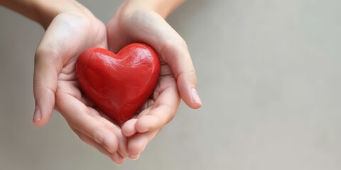 Hands Holding a Red Heart