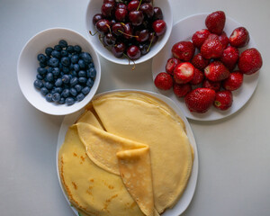 Fresh berries with pancakes or crepes for breakfast.