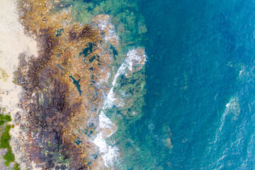 aerial view from drone of a rocky coast, directly above top view