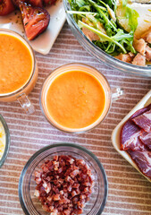 Spanish Salmorejo with Assorted Tapas on a Table