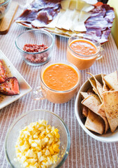 Spanish Salmorejo with Assorted Tapas on a Table