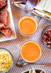 Spanish Salmorejo with Assorted Tapas on a Table