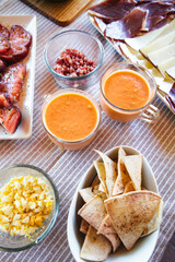 Spanish Salmorejo with Assorted Tapas on a Table