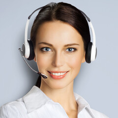 Call center help line service. Portrait of customer support phone sales operator in headset,...