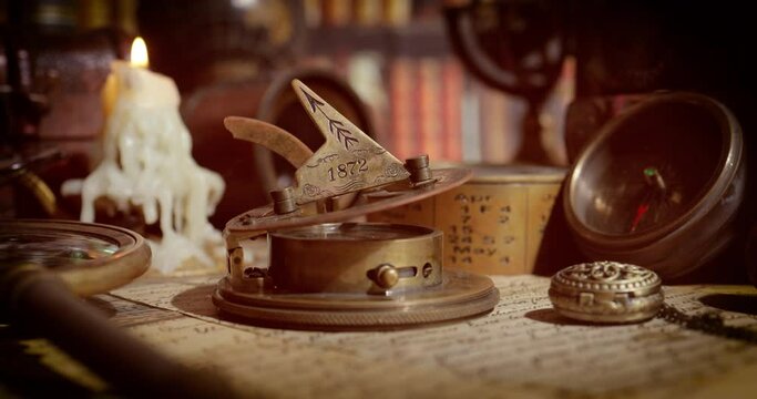 Vintage style travel and adventure. Vintage old compass and other vintage items on the table.