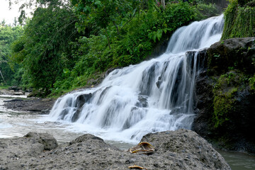 Fototapeta premium Uma Anyar Waterfall, at Kemenuh village, Gianyar Regency of Bali Indonesia, with beautiful nature landscape