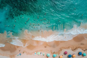 Obraz premium Aerial view of a sandy beach with people enjoying summer activities