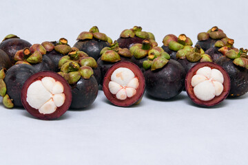 Queen of fruit. Mangosteens on the white background.