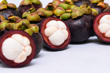 Queen of fruit. Mangosteens on the white background.